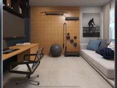 a living room with a couch, chair and desk in front of a wooden wall