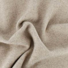 a close up view of a beige fabric