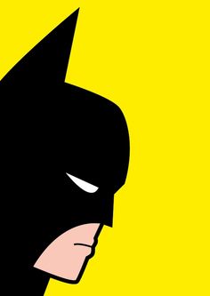 the face of batman in black and yellow