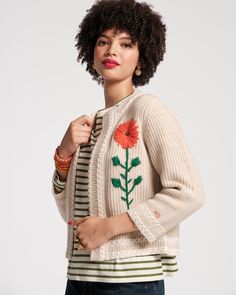 Your favorite Border Flower Cardigan is back, reemerging in our new fall colorway. This slightly cropped wool-cashmere cardigan features a sweetly embellished hand-embroidered flower on the bodice for a whimsical play on a classic silhouette. Long-Sleeve Cardigan Slightly cropped, open-knit sweater Wide border detail along the hemline Hand-embroidered flower design on one side Made with 90% wool and 10% cashmere Imported Flower Cardigan, Frances Valentine, Tall Leather Boots, Black Boots Tall, Open Knit Sweater, Cashmere Cardigan, Engineered Garments, Long Sleeve Cardigan, Sweater Coats