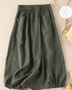 Elluis - Refined Retro-inspired Pleated Midi Skirt with a Sophisticated High Waist and Flattering A-line Silhouette Non-stretch Green Skirt, A-line Solid Color Bottoms For Summer, A-line Bottoms In Solid Color For Summer, Green Solid Color Skirt For Summer, Green A-line Bottoms For Spring, Green A-line Spring Bottoms, Non-stretch Green Long Skirt, Green Non-stretch Long Skirt, Green Non-stretch Skirt With Elastic Waistband