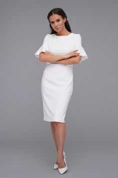 A cocktail dress featuring crew-neckline, pencil silhouette and short frilly sleeves. - crew-neckline - pencil silhouette - short frill sleeves - midi length (knee) - concealed back zipper closure - fully lined Color: milky white Outer fabric: 40% viscose, 55% polyester, 5% elastane. Lining : 57% viscose, 35% polyester, 8% elastane. Elegant Short Sleeve Midi Dress For Summer, Fitted Midi Dress With Ruffle Sleeves For Evening, Fitted Evening Midi Dress With Ruffle Sleeves, Elegant Ruffled Bodycon Dress, Ruffle Sleeve Dresses For Workwear, Midi Length Short Sleeve Dress For Office, Elegant Short Sleeve Dress With Ruffles For Summer, Elegant Midi Dress With Ruffle Sleeves And Details, Elegant Midi Dress With Ruffle Sleeves