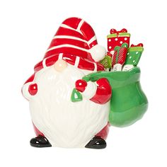 a santa clause figurine with candy canes in it