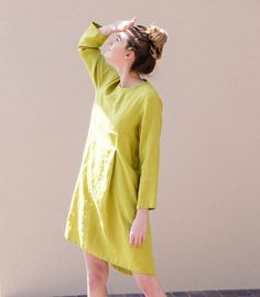 Handcrafted Oeko-Tex Standard certified 100% European linen smock dress ideal for everyday wear. Perfect for springtime or chilly summer days. Always dress to kill! Neckline: round Silhouette: A-line Length: ±44"/110cm (we can make adjustments) Sleeve length: 3/4 Pockets: side seam Details: *Colour shown:  pear green / forest green *Model is wearing size M *Medium weight *Maternity-friendly *Relaxed fit *Not-ironed (and no need to) *Handmade by @LinenCloud  Easy care: - Machine wash gentle - Was Spring Cotton Linen Dress In Flax Color, Green Linen Lagenlook Dress, Spring Linen Dress In Natural Color, Casual Linen Dress With Asymmetrical Hem, Green Relaxed Fit Linen Dress, Spring Linen Day Dress With Pockets, Spring Daywear Linen Dress With Pockets, Spring Beach Linen Dress With Asymmetrical Hem, Spring Lagenlook Dress With Pockets