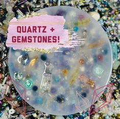 there is a sign that says quartz and gemstones on the top of a plate