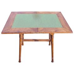 a wooden table with a green glass top