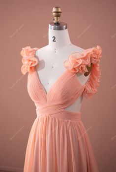 Peach Fairy Ruffled Sleeve Chiffon Plunging Formal Dress. This captivating peach pink chiffon formal dress takes exquisite charm to the next level. Featuring unique ruffled sleeves, sexy cutout detail and lace-up back on the plunging V neckline bodice, this flowing A-line long gown will set a new standard for special occasions. designed by Bettina & Brydealo Factory shown color peach bra support with cups boning no closure back hook + zipper lining fully lined Peach Dress Outfit Wedding, Coral Peach Bridesmaid Dresses, Peach Color Bridesmaid Dresses, Peach Dress Outfit, Peach Formal Dress, Brown Dresses Outfit, Botas Outfit, Peach Wedding Dress, Chiffon Formal Dress