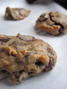 several chocolate chip cookies on a baking sheet