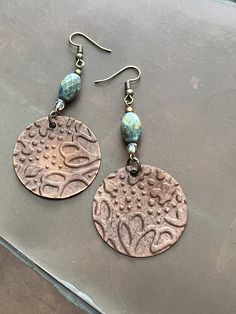 Handcrafted Boho Floral Botanical Embossed Metal and Czech Glass Bead Dangle Drop Earrings by BerndOfferings on Etsy Bohemian Etched Copper Earrings, Bohemian Drop Earrings With Etched Details, Bohemian Etched Drop Earrings, Artisan Etched Dangle Earrings, Bohemian Etched Metal Earrings, Bohemian Etched Dangle Earrings, Bohemian Etched Dangle Jewelry, Etched Metal Dangle Earrings, Embossed Metal