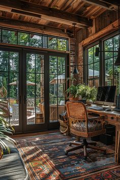 a home office with lots of natural wood and glass doors leading to an outdoor deck