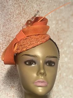 Orange Sequins Felt Half Hat for Church, Wedding, Mother of the Bride, Bridesmaids gift, Head Covering, Tea Parties Hat is trimmed with felt and crinoline bows, hat pin and feather stem. Perfect for any special occasion. The hat pin may vary and is for decorative purposes only. Measurement  5.3 inches circumference (base) Hat can be worn on either side of the head. Gifts for mom, sister, wife, or yourself. Covered Hats by Christian Design Studios Handmade Formal Hats, Elegant Adjustable Fascinator As A Gift, Elegant Headband Fascinator For Ceremony, Adjustable Costume Hats And Headpieces For Celebration, Elegant Adjustable Hair Accessories For Ceremony, Orange Party Hat Headpiece, Elegant Orange Costume Hats And Headpieces For Party, Elegant Orange Party Costume Hats And Headpieces, Party Adjustable Hats With Matching Headband