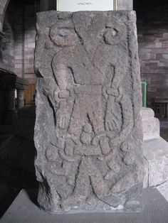 a stone carving in the middle of a room