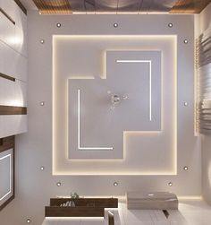 a room with white walls and flooring that looks like a maze in the ceiling