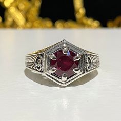 Sterling Silver Round cut Ruby Ring....Marked 925...Total of weights 3.1grams... Size 6...Measure of Face 11.2MM...It's in very good condition. Formal Ruby Ring In Sterling Silver Stamped 925, Formal Ruby Ring In Sterling Silver, Classic Silver Ruby Ring Stamped 925, Sterling Silver Ruby Ring With Diamond Cut, Classic Ruby Ring In Sterling Silver, White Gold Sterling Silver Ruby Ring Stamped 925, Fine Silver Ruby Ring With Diamond Cut, Classic Sterling Silver Ruby Ring Stamped 925, Classic Silver Ruby Ring With Diamond Cut