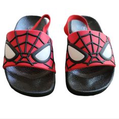 - Size: 5 - Age 2 Years Old - Spiderman - Color: Red And Black - Silicone Spiderman Upper - Sandals - Elastic Back Strap At The Heel - New With Box Cute Red Sandals For Summer, Playful Black Sandals For The Beach, Fun Red Open Toe Sandals, Fun Black Sandals For Vacation, Cute Red Sandals For The Beach, Cute Red Beach Sandals, Playful Red Open Toe Sandals, Playful Non-slip Black Sandals, Red Shark Slides