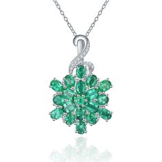 Georgius Snowflake shape Emerald Pendant and chain. Natural Zambian Emerald 3.24ct. Silver 3.36g. White Zircon 0.07ct. Available in White Gold and Sterling Silver. Fine Jewelry Silver Emerald Necklace With Diamond Cut, Dazzling Silver Emerald Necklace As Gift, Dazzling Silver Emerald Necklace Gift, Elegant White Gold Necklace For Christmas, Silver Emerald Necklace With Brilliant Cut, Dazzling Brilliant Cut Emerald Necklace Gift, Silver Emerald Necklace With Brilliant Cut In Sterling Silver, White Gold Emerald Necklace With Diamond Accents As Gift, White Gold Diamond Emerald Necklace As Gift