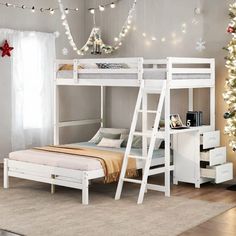 a white bunk bed sitting in a bedroom next to a christmas tree with lights on it