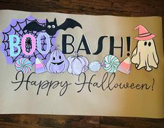 a paper sign that says boo bash happy halloween with ghost, bats and pumpkins