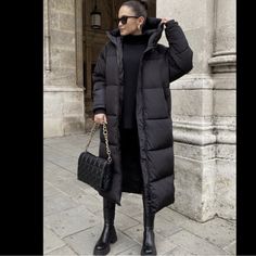 Down Coat With Feather And Down Fill. High Collar With Removable Adjustable Drawstring Hood. Long Sleeves With Interior Cuffs. Long Black Puffer Coat Outfit, Long Puffer Outfit, Black Puffer Coat Outfit, Puffer Coat Street Style, Long Puffer Coat Outfit, Black Puffer Outfit, Long Puffer Jacket Outfit, Puffy Jacket Outfit, Long Black Puffer Coat