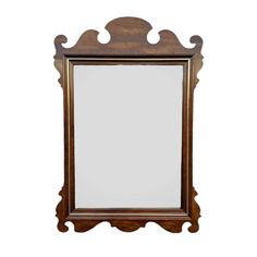 a wooden frame mirror on a white background