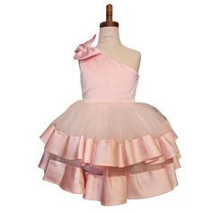 This dress can be worn for any special occasion like weddings, pageants, birthday parties, holiday parties (Christmas or New Years), Father/Daughter Dances, kid's proms, etc Features: Bowknot On One Shoulder Multi-layer Ruffles Satin and Tulle V Back Knee Length Use a crinoline to make the dress stand out Care: Light Iron or Steam to knock out wrinkles; Dry Clean or Spot Clean Pair with our champagne kitten heels to make this dress all the more festive! Spring Sleeveless Pageant Dress For Dress-up, Spring Sleeveless Pageant Dress, Sleeveless Spring Pageant Dress, Holiday Princess Dress Ball Gown, Spring Ball Gown Tutu Dress For Dress-up, Fitted Sleeveless Tulle Holiday Dress, Holiday Princess Tutu Dress For Dress-up, Holiday Tulle Dress With Ruffles, Pink Sleeveless Holiday Dress For Wedding