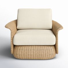 a wicker chair with a white cushion and footstool on an isolated background