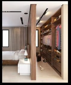 a bedroom with a bed, closet and dressing area in the middle of it is shown