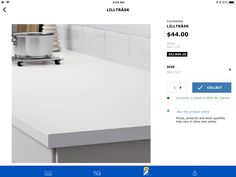 a white counter top sitting on top of a kitchen counter