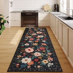 a kitchen area rug with flowers on it in front of an oven and counter top