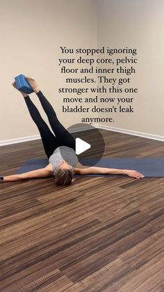 a woman is doing yoga on the floor with her feet up and arms in the air