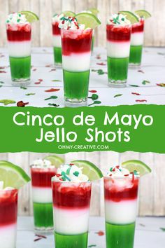 several shots in glasses with green and red garnish on the rim, topped with whipped cream