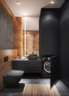 a washer and dryer in a very modern bathroom