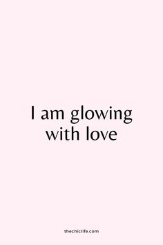 the words i am glowing with love are shown in black and white on a pink background