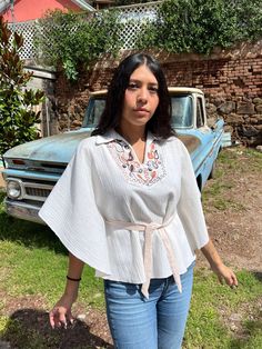 "This is an absolutely stunning linen-like polycotton poncho in amazing vintage condition! It has beautiful embroidered floral art on the neckline/chest. It's not heavy and lightweight to wear, insanely comfortable! The sides are oversized sleeves which you don't need to wear a bottom to it but can go with nothing under as well. There are two slits for the waist belt. This is an absolutely amazing piece to add to your vintage collection! I got so many compliments when I wore it! Measurements are Poncho With Belt, Granny Square Poncho, Boho Poncho, Oversized Sleeves, Oversize Sleeves, Red Velvet Dress, Ladies Poncho, Wool Poncho, Fringed Poncho