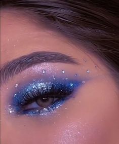 Light Blue Eye Makeup With Gems, Blue Eye Makeup 2023, Classy Blue Eye Makeup, Sapphire Tears Makeup, Sparkles Eye Makeup, Blue Chrome Makeup, Blue Rhinestone Eye Makeup, Blue Eyeshadow Rhinestones, Blue Sparkly Makeup Looks