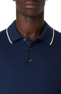 Knit from a breathable cotton-blend yarn with a cozy cable stitch, this short-sleeve polo-sweater is soft against the skin for comfortable styling. 27" length (size Medium) Button half-placket Spread collar Short sleeves 90% cotton, 10% polyester Machine wash, dry flat Made in Turkey Fitted Navy Polo Sweater With Ribbed Collar, Knit Polo Shirt With Polo Collar, Navy Short Sleeve Polo Sweater With Ribbed Collar, Casual Navy Knit Polo Sweater, Fitted Cable Knit Polo Sweater, Navy Cable Knit Casual Top, Casual Pointelle Knit Polo Sweater, Casual Collared Cable Knit Top, Navy Casual Cable Knit Top