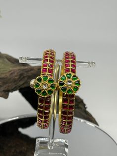 We bring beautiful Jewelry sure to elevate any look! Kindly pay attention to all photos and video and ask questions about the item prior to ordering. Temple Jewelry Style Jeweled Bangle For Wedding, Temple Style Jeweled Bangle For Weddings, Traditional Jeweled Bracelets For Weddings, Traditional Ruby Bangle For Festive Occasions, Traditional Jeweled Green Bracelets, Traditional Green Jeweled Bracelets, Ceremonial Green Bracelets With Tilla Detail, Traditional Kundan Jeweled Bracelets, Green Kundan Bangle For Ceremonial Occasions