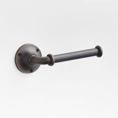 an image of a metal handle on a white wall with no background in this photo