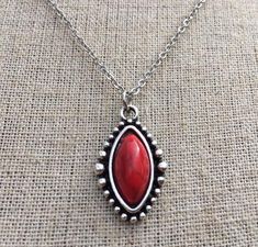 Simple, chic and versatile!  Here is a red stone necklace that is set in a perfectly detailed silver frame.  The perfect everyday necklace! Made from allergy free plated silver.  The pendant measures 1” long by 1/2” wide.  It hangs from a shiny strong 18” stainless steel necklace chain with a lobster clasp.I have matching earrings in my shop if you would like the whole set.  Here is the link............. https://etsy.me/2R5NsWx I have this same style pendant necklace available in other color way Southwestern Style Red Jewelry For Gift, Southwestern Style Red Jewelry For Gifts, Red Southwestern Style Jewelry Gift, Southwestern Style Red Necklace For Gift, Southwestern Style Red Gemstone Jewelry, Red Southwestern Turquoise Necklace For Gift, Red Bohemian Sterling Silver Jewelry, Bohemian Red Necklaces, Southwestern Red Gemstone Jewelry