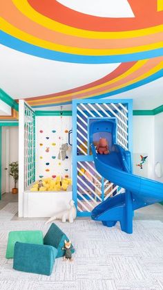 a child's playroom with colorful walls and furniture