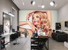 a hair salon with a large wall mural in the background