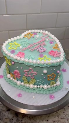 a decorated cake sitting on top of a counter