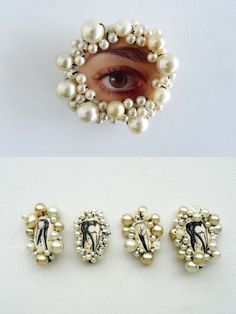 three pairs of pearled earrings with an eye in the middle