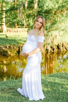 Summer maternity shoot! This white Short-Sleeve Off the Shoulder Sweetheart Maternity Gown is the perfect photoshoot, baby shower, or special event. With a cross over sweetheart bust, a slim fit bodice, a simple flare, and ultra-soft, stretch material this gown is equal parts comfort and elegance.  #maternitygown #maternityphotos #photoshoot #whitegown #summerphotos #summer #prettymama #momtobe #pregnant Fitted Empire Waist Maternity Dress For Wedding, Maternity Fitted Dress With Sweetheart Neckline, Fitted Empire Waist Maternity Maxi Dress, Maternity Gown With Sweetheart Neckline, Fitted Maternity Dress With Sweetheart Neckline, Maternity Fitted Gown With Sweetheart Neckline, Fitted Off-shoulder Maternity Dress For Wedding, Fitted Maternity Gown With Sweetheart Neckline, Elegant Maternity Dress With Sweetheart Neckline