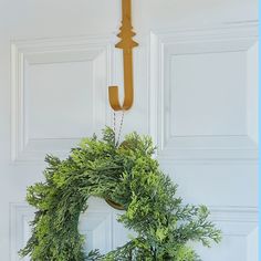 a wreath is hanging on the front door