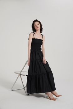 This timeless Tiered Ruffle Slip Maxi Dress will become a wardrobe staple. Crafted from a lightweight blend of 55% Cotton and 45% Modal, it features a spaghetti shoulder strap, straight neck, smocking bodice, eye-catching 3D piping detail along the tiered seam, two side pockets, and an unlined finish. Perfect for summer evenings. Spaghetti shoulder strap Straight neck Smocking bodice 3D piping detail along the tiered seam Two side pockets Unlined (in) S M L Length (Excluding Suspenders) 44.1 44. Maxi Length Smocked Sundress With Tie Straps, Chic Sleeveless Smocked Dress With Adjustable Straps, Chic Midi Dress With Smocked Bodice And Straight Neckline, Chic Smocked Dress With Tie Straps For Spring, Chic Smocked Midi-length Dress With Tie Straps, Chic Smocked Midi Dress With Tie Straps, Chic Smocked Dress With Adjustable Straps For Summer, Chic Smocked Dress With Spaghetti Straps For Brunch, Chic Smocked Dress With Spaghetti Straps For Daywear