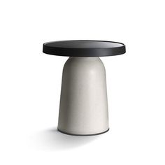 a white table with black top on a white background in the shape of a cone