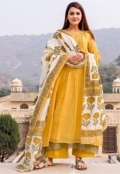 Readymade Kota Doria Pakistani Suit in Mustard This Round Neck and Quarter Sleeve attire is Prettified with Tucks, Resham and Sequins Work Available with a Mustard Cotton Palazzo and a Off White Floral Printed Art Chanderi Silk Dupatta The Kameez and Bottom Lengths are 45 and 40 inches respectively Do note: The Length may vary upto 2 inches. Accessories shown in the image are for presentation purposes only.(Slight variation in actual color vs. image is possible). Cotton Suit Designs, Vs Image, Kota Doria Suits, Yellow Suit, Pakistani Suit, Kurta Set For Women, Neck Designs For Suits, Girls Frock Design, Utsav Fashion