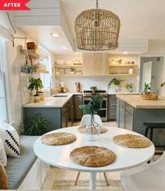 a white table with place mats on it in a kitchen next to a sink and stove