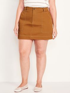 button front belt loops zip fly front utility pockets back patch pockets hammer loop sits at belly button hits at thigh models are approx.  5'9" and wear sizes s (4), l (12) and xl (18)machine wash according to the care instruction label Plus Size 20, Utility Skirt, Utility Pockets, Belly Button, Tan Brown, Patch Pocket, Mini Skirt, Old Navy, Womens Skirt